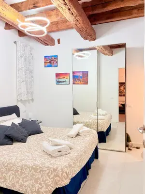 Letto o letti in una camera di Ca' Spritz - Home