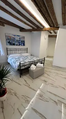 Letto o letti in una camera di Ca lucia Canal View
