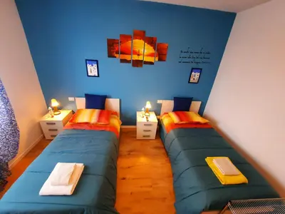 Letto o letti in una camera di New Bedrooms Mamma Gigetta
