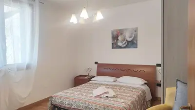 Letto o letti in una camera di Appartamento LA PERLA