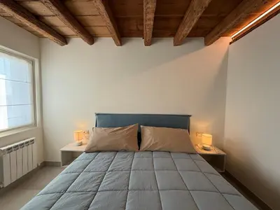 Letto o letti in una camera di Iris House