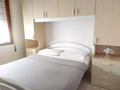 Letto o letti in una camera di Apartments in Rosolina Mare 48309