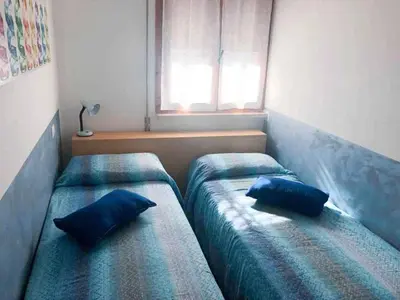 Letto o letti in una camera di Apartment in Cavallino-Treporti 48302