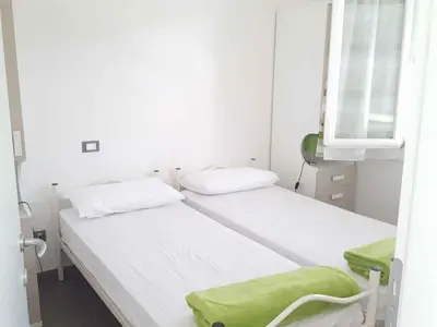 Letto o letti in una camera di Holiday Homes in Rosolina Mare 48310