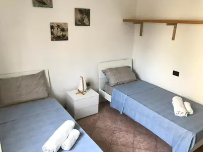 Letto o letti in una camera di Casa Rita