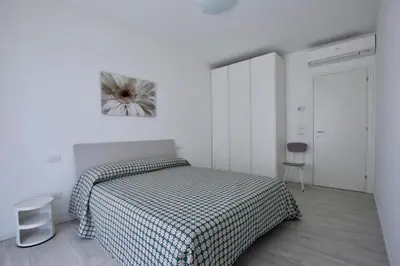 Letto o letti in una camera di Equilium - Home Immobiliare