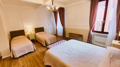 Letto o letti in una camera di Venice Twist Suite