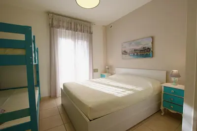 Letto o letti in una camera di Pagoda - Home Immobiliare