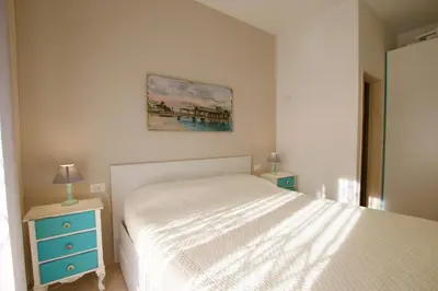 Letto o letti in una camera di Pagoda - Home Immobiliare