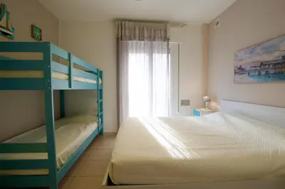 Letto o letti in una camera di Pagoda - Home Immobiliare