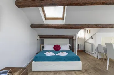 Letto o letti in una camera di Nice Lovely Attic for 4 person with Wifi - A/C
