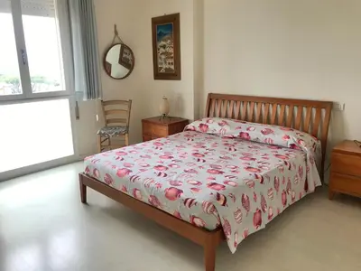 Letto o letti in una camera di Attico Vista Mare