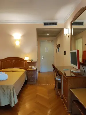 Letto o letti in una camera di Hotel Firenze