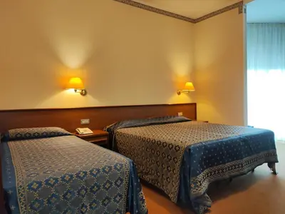 Letto o letti in una camera di Hotel Firenze