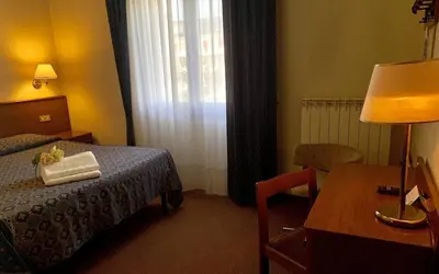Letto o letti in una camera di Hotel Firenze