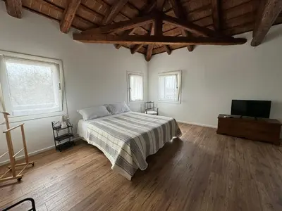 Letto o letti in una camera di Casa Toè Quinto