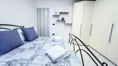 Letto o letti in una camera di Casa Raffi by Ca-Sa Check