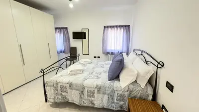 Letto o letti in una camera di Casa Raffi by Ca-Sa Check