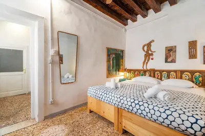 Letto o letti in una camera di Casa Trecento