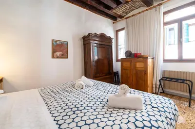 Letto o letti in una camera di Casa Trecento