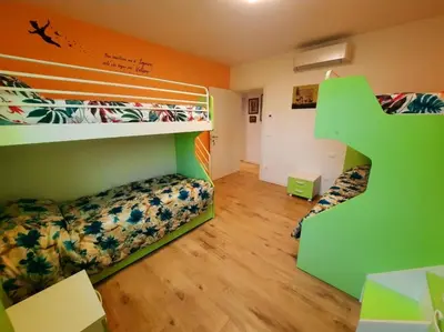 Letto o letti in una camera di New Bedrooms Mamma Gigetta