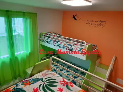 Letto o letti in una camera di New Bedrooms Mamma Gigetta