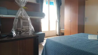 Letto o letti in una camera di Hotel Heron