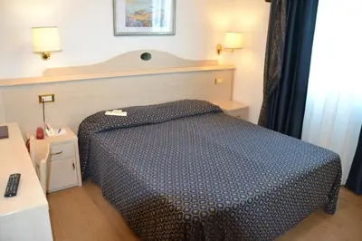 Letto o letti in una camera di Hotel Caravelle&MiniCaravelle