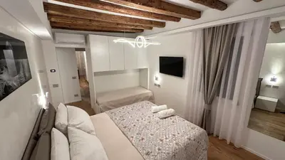 Letto o letti in una camera di PALAZZO MICHELIN SUITE