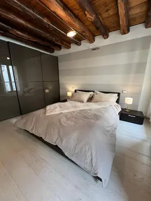 Letto o letti in una camera di Ca' Del Vecio, in centro storico, Piazza Garibaldi