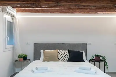 Letto o letti in una camera di LONGA studio by Welc(H)ome
