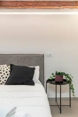 Letto o letti in una camera di LONGA studio by Welc(H)ome