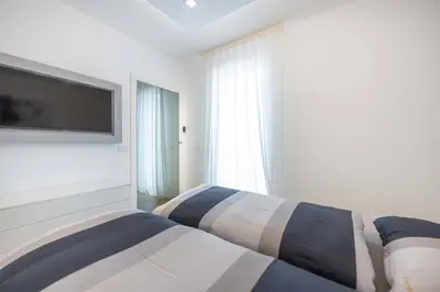 Letto o letti in una camera di Wave Resort Stamar C10
