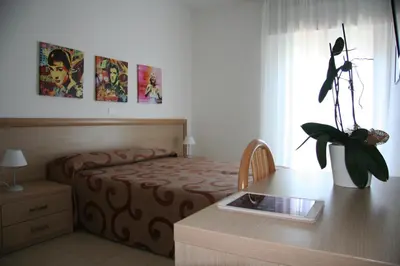 Letto o letti in una camera di Appartamenti Aquamarina