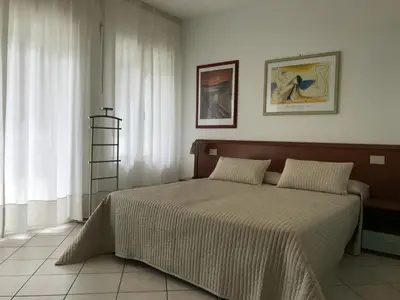 Letto o letti in una camera di Appartamenti Aquamarina