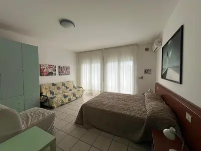 Letto o letti in una camera di Appartamenti Aquamarina