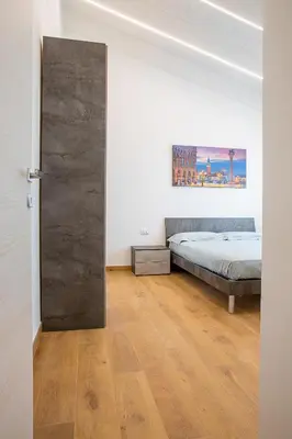 Letto o letti in una camera di APPARTAMENTI CAVALLINO-TREPORTI