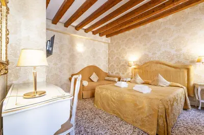Letto o letti in una camera di Residence Ca' di Malta Arsenale by Wonderful Italy
