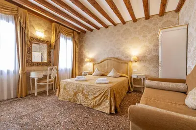 Letto o letti in una camera di Residence Ca' di Malta Arsenale by Wonderful Italy