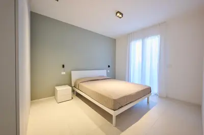 Letto o letti in una camera di Sun Village Apartments