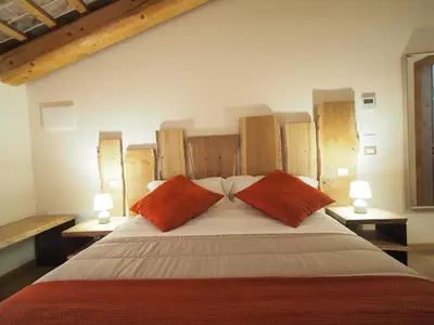 Letto o letti in una camera di AZIENDA AGRICOLA CA' LUNGA