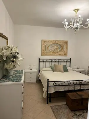 Letto o letti in una camera di Villa bifamiliare per famiglie con giardino.