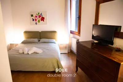 Letto o letti in una camera di Sole & Luna apartments