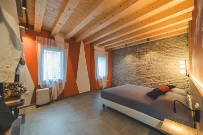 Letto o letti in una camera di BATTISTI HOSPITALITY - motocicletta