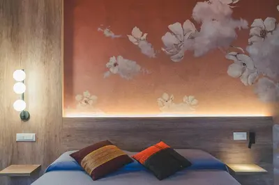 Letto o letti in una camera di BATTISTI HOSPITALITY - motocicletta