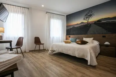 Letto o letti in una camera di La Giuggiola