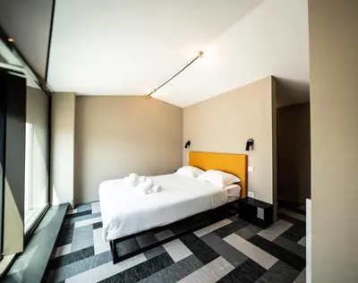 Letto o letti in una camera di BASALTO Venice Mestre Apartments