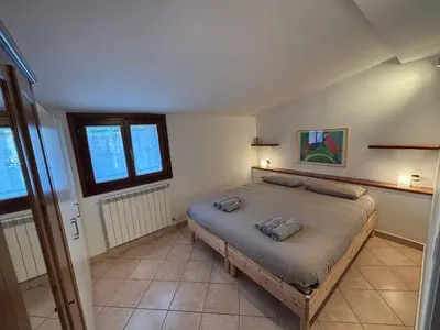 Letto o letti in una camera di La Mansardina