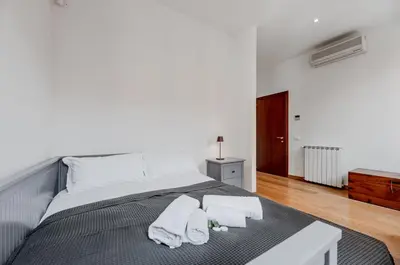 Letto o letti in una camera di GuestHost - Elegant Apartment near Piazza San Marco