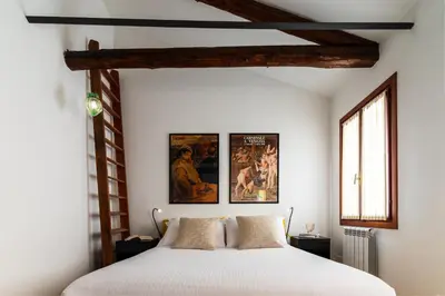 Letto o letti in una camera di Tintoretto Cozy Duplex R&R